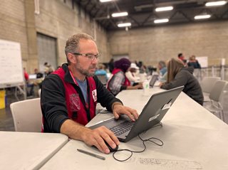 Canadian Red Cross volunteer Tom Soldan working at the Edmonton Expo Centre to support people evacuated due to fires in the Northwest Territories