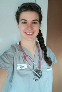 Ayden Dewar pictured in her nursing scrubs.