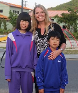 Kathy standing with the Matsuhashi family one year after devastating tsunami in Japan in 2011