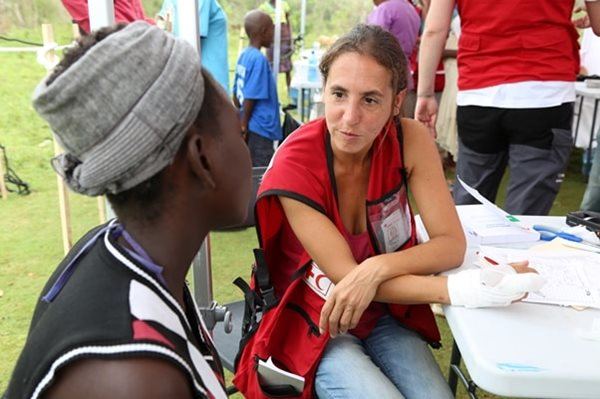 Canadian Red Cross Doctor and specialist in community health Shelley-Rose Hyppolite treats patient