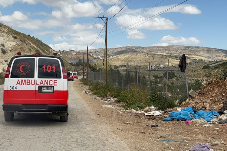 A Palestine Red Crescent Society ambulance driving on a road in the Tammoun Village.
