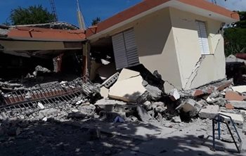 A home collapsed into rubble after an earthquake in Haiti