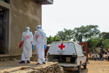 Two Red Cross members dressed in personal protective equipment in response to Ebola outbreak in the Congo