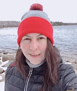 A woman in winter toque outside in winter